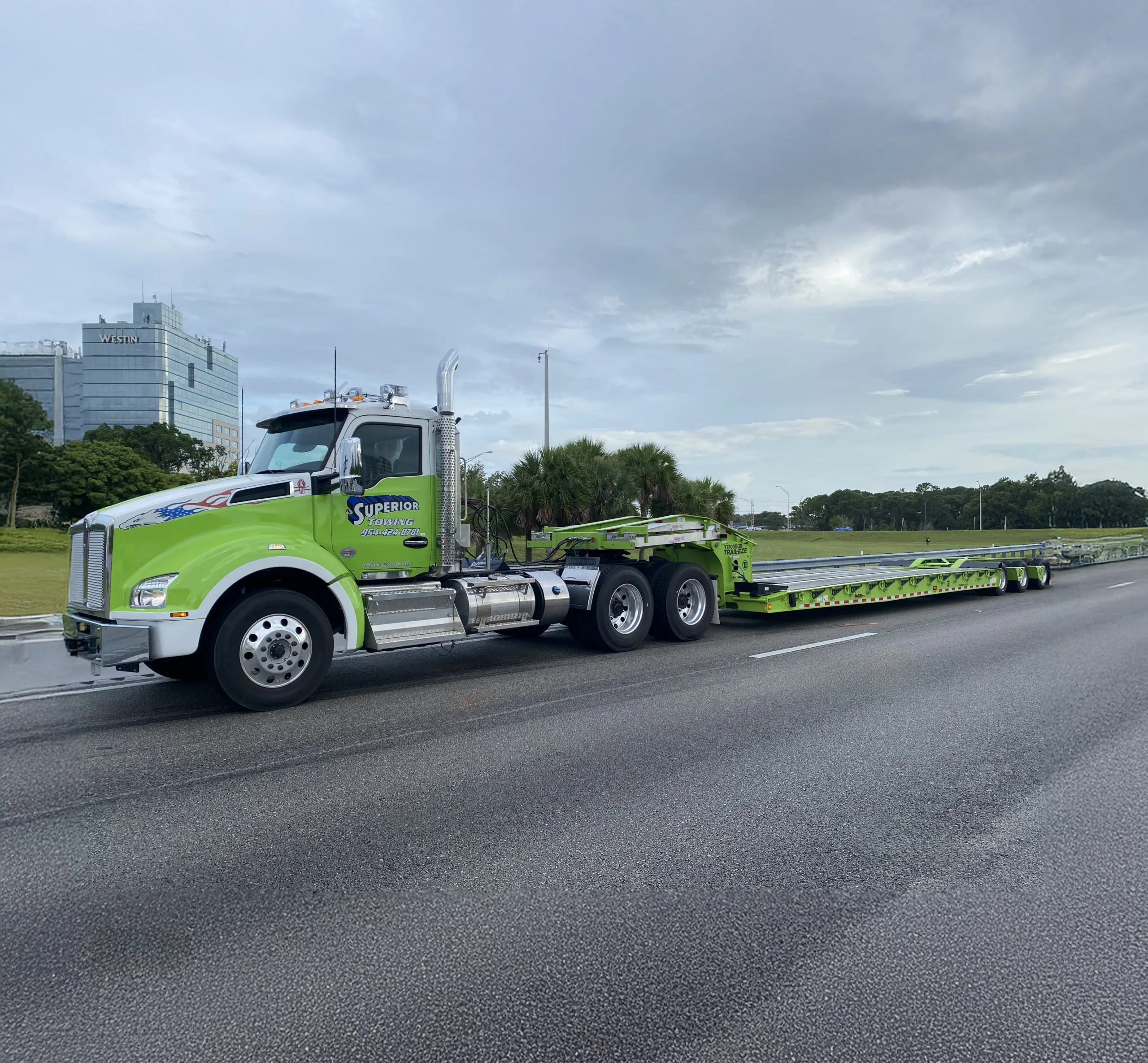Superior Towing heavy haul and equipment transport services in Davie FL using lowboy trailer