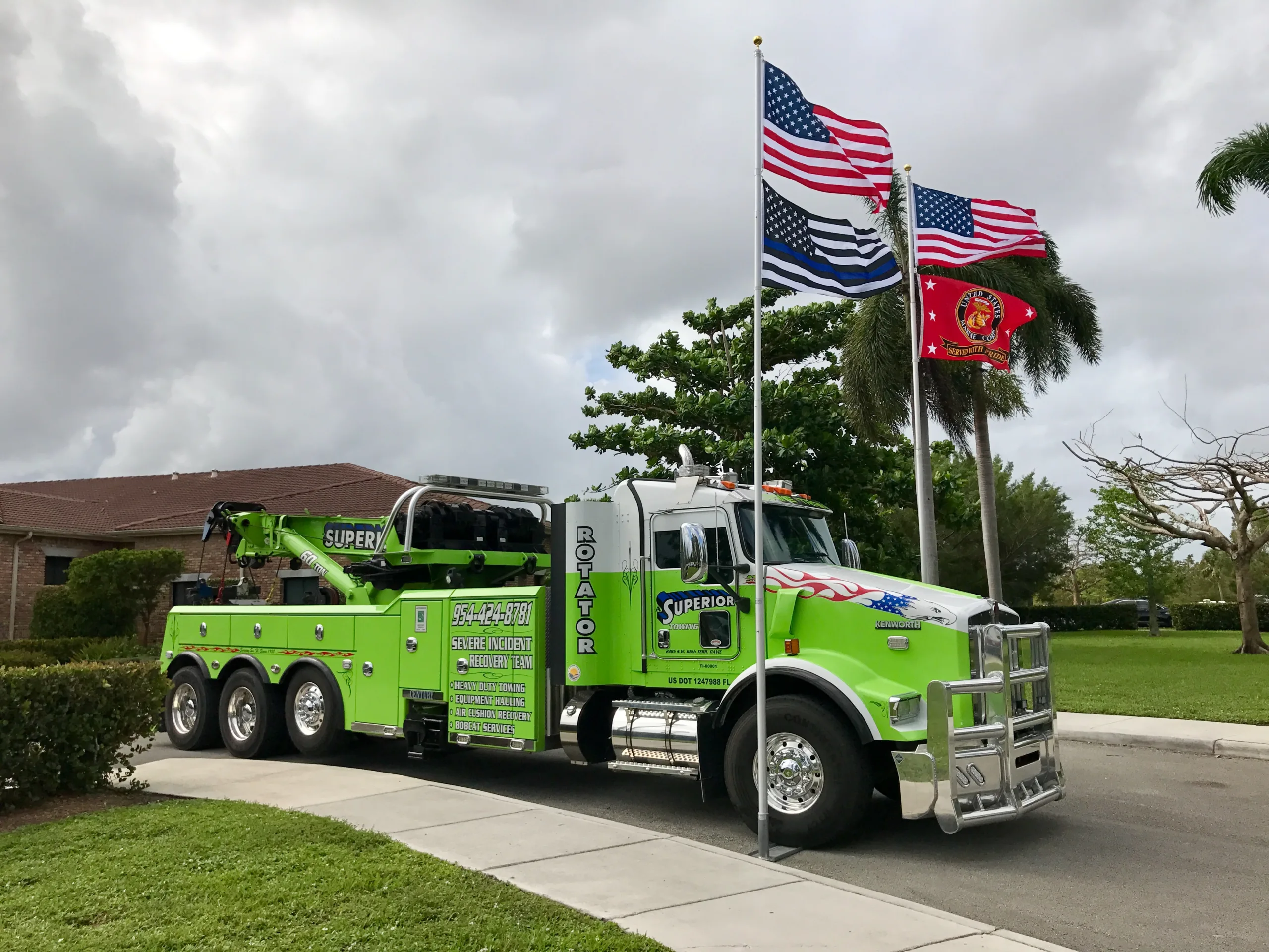 A Superior Towing's heavy-duty rotator tow truck recovering a large commercial vehicle in Davie, FL - heavy-duty towing specialists.