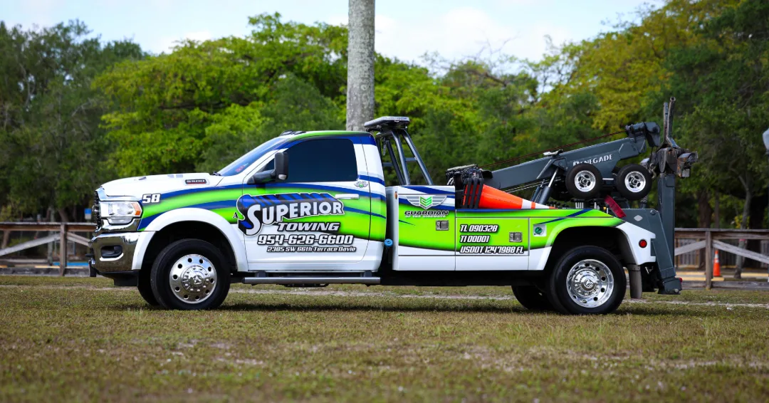 Light duty tow truck from A Superior Towing safely transporting a car in Davie, FL - expert light duty towing and recovery.